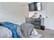 Comfortable bedroom with a large bed, a mirrored dresser, and white walls at 7621 Avalon Blvd, Fairburn, GA 30213