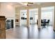 Bright open-concept living room connected to the kitchen and dining area at 7621 Avalon Blvd, Fairburn, GA 30213