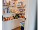 Walk-in pantry featuring an abundance of shelving filled with various food items at 7621 Avalon Blvd, Fairburn, GA 30213