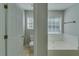 Bathroom with a garden tub and a toilet at 981 Charles Hall Dr, Dacula, GA 30019