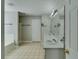 Bathroom featuring double sinks, soaking tub, and separate shower at 981 Charles Hall Dr, Dacula, GA 30019