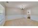 Formal dining room with wainscoting, chandelier, and neutral paint, perfect for entertaining at 981 Charles Hall Dr, Dacula, GA 30019