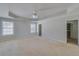 Spacious main bedroom featuring tray ceiling and a walk-in closet at 981 Charles Hall Dr, Dacula, GA 30019