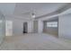 Large main bedroom with tray ceiling and ensuite bathroom entrance at 981 Charles Hall Dr, Dacula, GA 30019