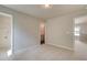Neutral bedroom with carpeted floors, with access to a bathroom and another bedroom at 288 Abbotts Crossing Cir, Conyers, GA 30094