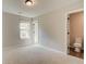 Bedroom features carpet, neutral paint and ensuite bath at 288 Abbotts Crossing Cir, Conyers, GA 30094