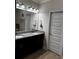 Bathroom featuring a double sink vanity with granite countertop at 4858 Stratford Ln, Johns Creek, GA 30022