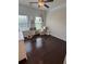 Bedroom with hardwood floors, natural light, and decorative shelving at 4858 Stratford Ln, Johns Creek, GA 30022