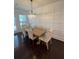 Bright and airy dining room featuring a wooden table, upholstered chairs, and elegant chandelier at 4858 Stratford Ln, Johns Creek, GA 30022