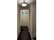 Elegant front entrance hallway with dark wood floors, neutral walls, and modern lighting fixtures at 4858 Stratford Ln, Johns Creek, GA 30022
