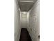 Hallway with dark hardwood flooring, white doors, and trim at 4858 Stratford Ln, Johns Creek, GA 30022