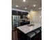 Modern kitchen with stainless steel appliances, granite countertops, and an island with seating at 4858 Stratford Ln, Johns Creek, GA 30022