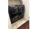 Modern laundry room features a front load Samsung washer and dryer at 4858 Stratford Ln, Johns Creek, GA 30022