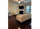 Bright living room featuring a fireplace and a neutral color scheme with dark hardwood flooring at 4858 Stratford Ln, Johns Creek, GA 30022