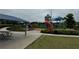 A vibrant community playground with slides, climbing structures, and covered picnic area at 4858 Stratford Ln, Johns Creek, GA 30022