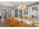 Sun-filled dining room with seating for eight and views into the living room at 958 Austin Ne Ave, Atlanta, GA 30307