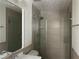 Bathroom featuring a tiled shower with glass doors, toilet and sink at 1185 Jocelyn Ct, Stone Mountain, GA 30088