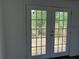 French doors leading to a backyard deck at 1185 Jocelyn Ct, Stone Mountain, GA 30088