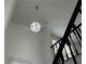 High-ceiling entryway with a decorative light fixture and a view of the staircase at 1185 Jocelyn Ct, Stone Mountain, GA 30088