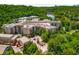 Stunning aerial view of a lakeside community with lush green trees and beautiful architecture at 200 River Vista Dr # 540, Atlanta, GA 30339