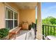 A balcony with a view, furnished with neutral colors with a cabinet and a small dining table at 200 River Vista Dr # 540, Atlanta, GA 30339