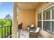 A view of a quiet balcony with two chairs with cushions, providing a peaceful and relaxing outdoor space at 200 River Vista Dr # 540, Atlanta, GA 30339