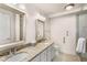 Bathroom with double sinks, granite counters, and a glass enclosed shower at 200 River Vista Dr # 540, Atlanta, GA 30339