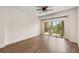 Bright bedroom featuring hardwood floors and a sliding glass door leading to a private balcony at 200 River Vista Dr # 540, Atlanta, GA 30339