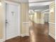 Elegant condo hallway with wooden floors, neutral paint, and access to an elevator at 200 River Vista Dr # 540, Atlanta, GA 30339