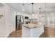 Well-equipped kitchen with a large island, white cabinetry, and stainless steel appliances at 200 River Vista Dr # 540, Atlanta, GA 30339