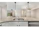 Spacious kitchen island with granite countertop and stainless appliances open to living area and balcony at 200 River Vista Dr # 540, Atlanta, GA 30339