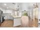 Modern kitchen with white cabinets, granite countertops, and stainless steel appliances at 200 River Vista Dr # 540, Atlanta, GA 30339