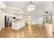 Open-concept living space with a gourmet kitchen, hardwood floors, and sliding glass doors at 200 River Vista Dr # 540, Atlanta, GA 30339