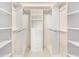 Spacious walk-in closet with custom shelving and drawer system for organized storage at 200 River Vista Dr # 540, Atlanta, GA 30339