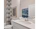 Well-lit bathroom featuring a white vanity with a modern faucet and stylish decor at 290 Abbotts Crossing Cir, Conyers, GA 30094