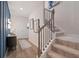 Spacious foyer showcasing the staircase, wood floors, and stylish decor upon entering this home at 290 Abbotts Crossing Cir, Conyers, GA 30094