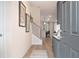 View of the home's entryway displaying light wood floors and a modern staircase with iron spindles at 290 Abbotts Crossing Cir, Conyers, GA 30094