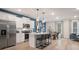 This spacious kitchen shows a center island, stainless steel appliances, and an eat-in kitchen area at 290 Abbotts Crossing Cir, Conyers, GA 30094