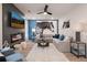 Elegant living room with a fireplace, television, and a large sectional sofa at 290 Abbotts Crossing Cir, Conyers, GA 30094