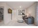 Relaxing living area with tv, two armchairs, and an ottoman at 290 Abbotts Crossing Cir, Conyers, GA 30094