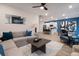 Bright and airy living space with an open layout, connecting the living room, dining area, and kitchen at 290 Abbotts Crossing Cir, Conyers, GA 30094