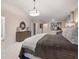Comfortable main bedroom featuring a neutral color palette, cozy textures, and sleek lighting fixture at 290 Abbotts Crossing Cir, Conyers, GA 30094