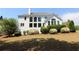 Expansive backyard featuring lush lawn, mature trees, and landscaping surrounding a two-story home at 5029 Preservation Pointe, Kennesaw, GA 30152
