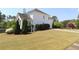 Well-maintained yard with grass and mature landscaping surrounds a two-story home at 5029 Preservation Pointe, Kennesaw, GA 30152