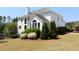 Beautiful backyard with a lush lawn and mature landscaping that surrounds a two-story home at 5029 Preservation Pointe, Kennesaw, GA 30152