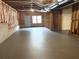 Unfinished basement with concrete floor, door to outside, and exposed ceiling with ductwork at 5029 Preservation Pointe, Kennesaw, GA 30152