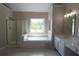 Bathroom with tub, separate shower, and dual sink vanity with great natural light at 5029 Preservation Pointe, Kennesaw, GA 30152
