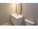 Bathroom with vanity, framed mirror, toilet, and tile floor at 5029 Preservation Pointe, Kennesaw, GA 30152