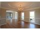 Open dining room area features hardwood floors, decorative molding, and ample natural light at 5029 Preservation Pointe, Kennesaw, GA 30152