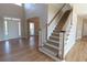 Inviting entryway showcases a staircase, hardwood floors, and abundant natural light at 5029 Preservation Pointe, Kennesaw, GA 30152